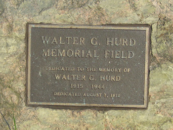 the Hurd memorial plaque that is attached to a large rock in the park